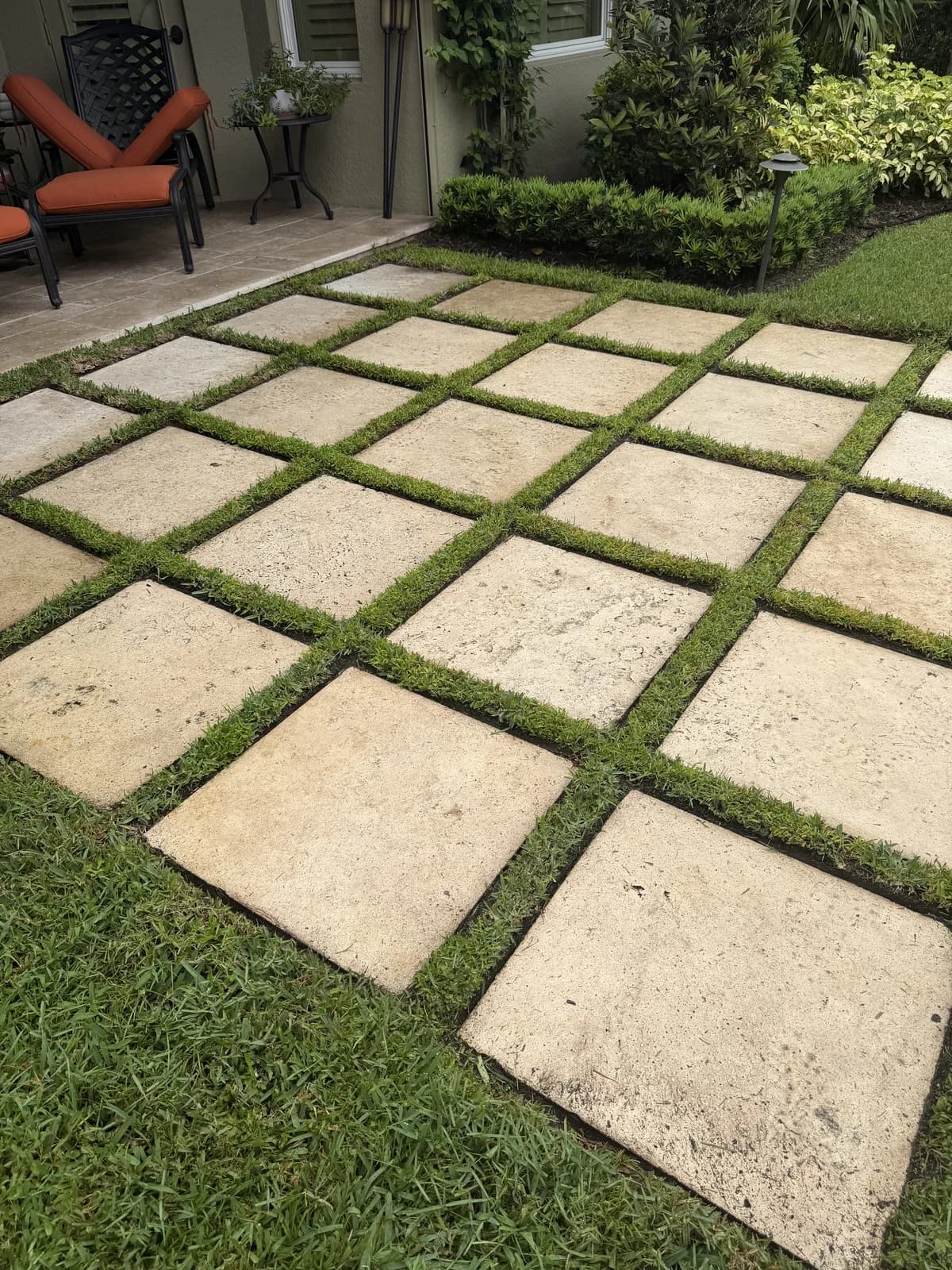 Square pavers set in turf with crisp grass joints